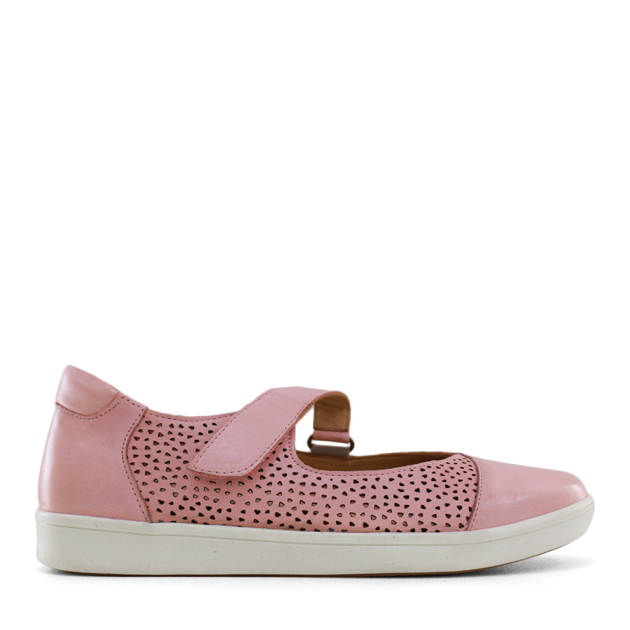 SIDE VIEW OF PINK CASUAL SHOE WITH VELCRO STRAP AND SPECKLE CUT OUT DETAILING ON THE SIDES 