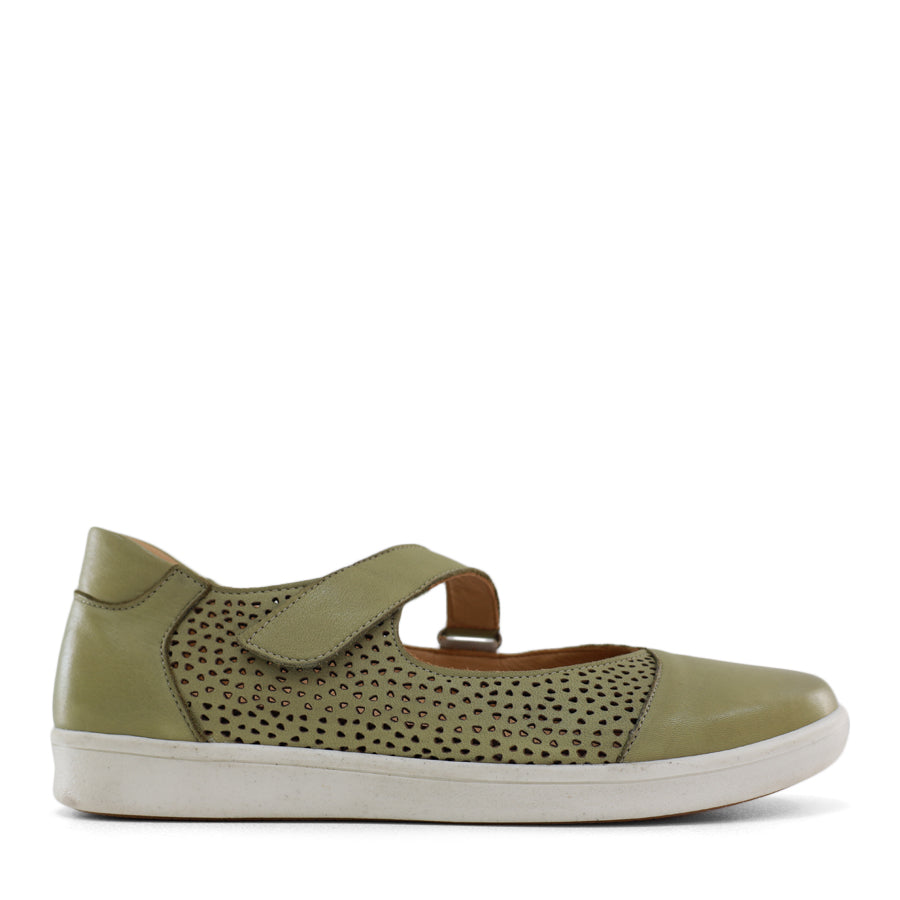 SIDE VIEW OF GREEN CASUAL SHOE WITH VELCRO STRAP AND SPECKLE CUT OUT DETAILING ON THE SIDES 