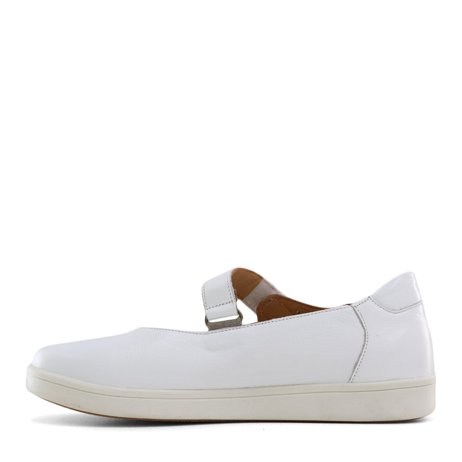 SIDE VIEW OF WHITE CASUAL SHOE WITH VELCRO STRAP AND SPECKLE CUT OUT DETAILING ON THE SIDES 