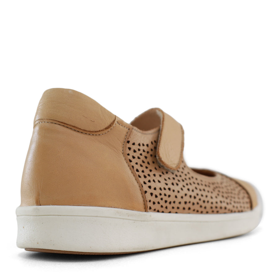 BACK VIEW OF TAN CASUAL SHOE WITH VELCRO STRAP AND SPECKLE CUT OUT DETAILING ON THE SIDES 