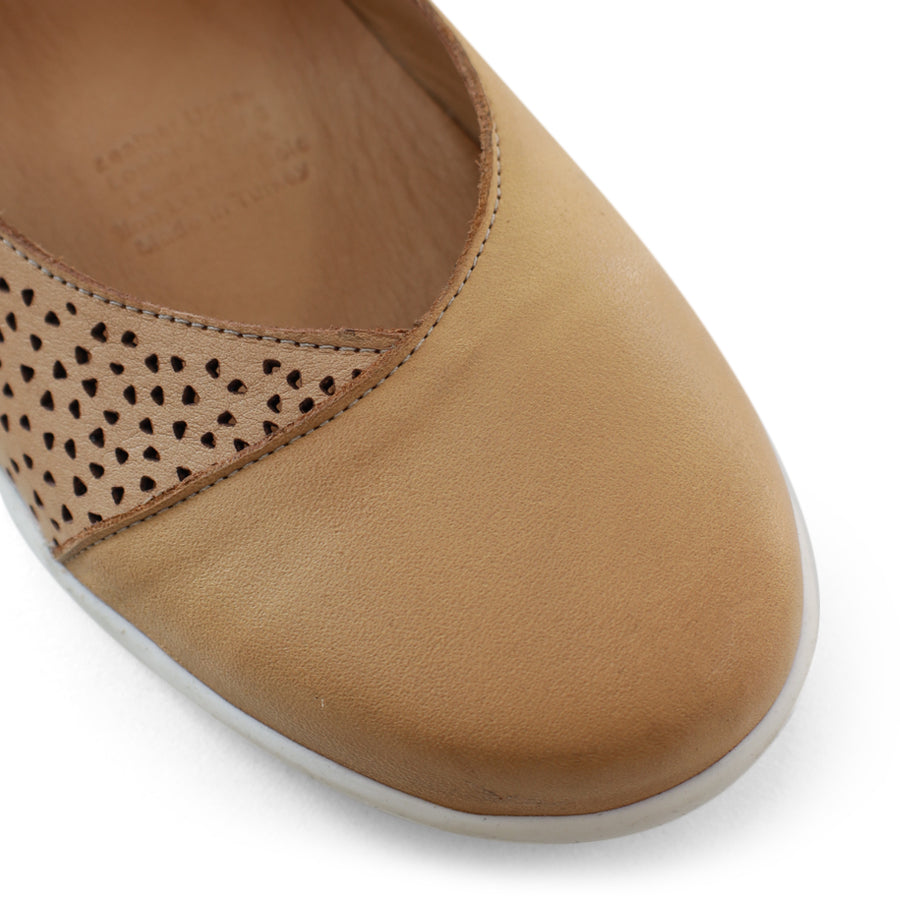 FRONT VIEW OF TAN CASUAL SHOE WITH VELCRO STRAP AND SPECKLE CUT OUT DETAILING ON THE SIDES 