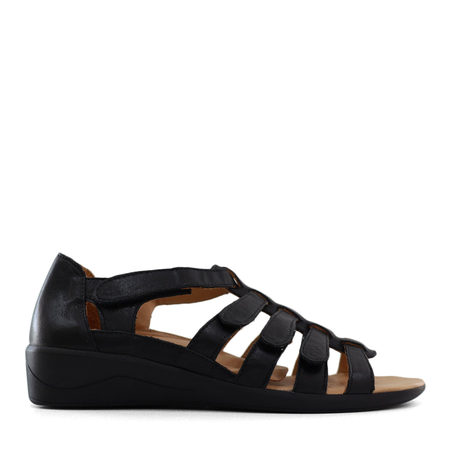 SIDE VIEW OF BLACK T BAR SANDAL WITH VELCRO STRAP AND SMALL HEEL 