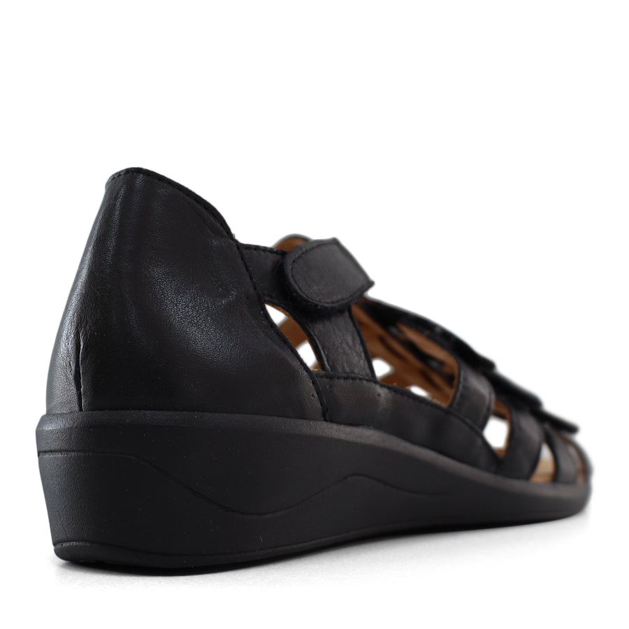 BACK VIEW OF BLACK T BAR SANDAL WITH VELCRO STRAP AND SMALL HEEL 