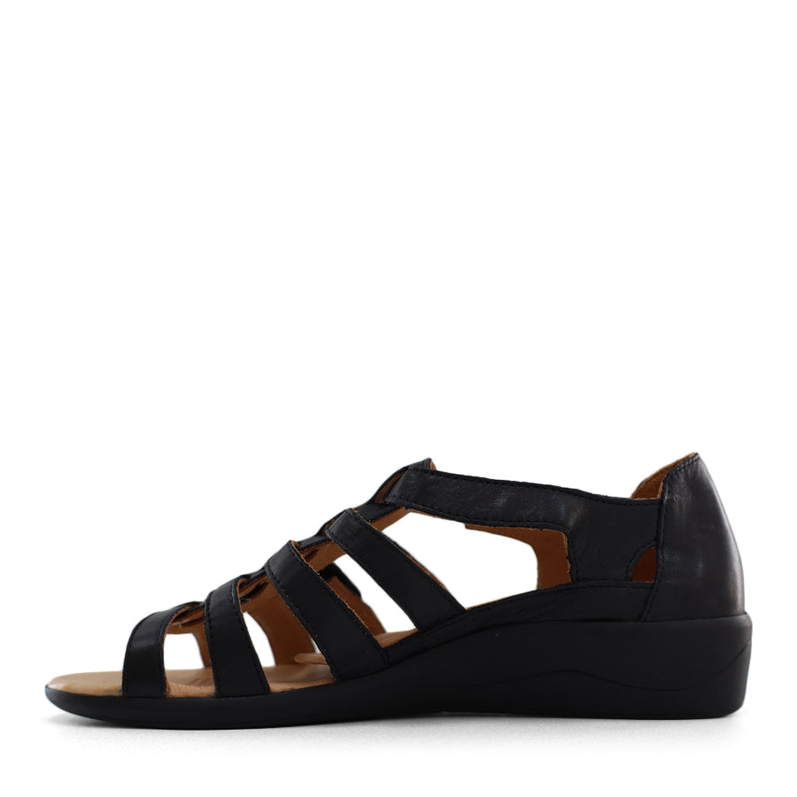 SIDE VIEW OF BLACK T BAR SANDAL WITH VELCRO STRAP AND SMALL HEEL 