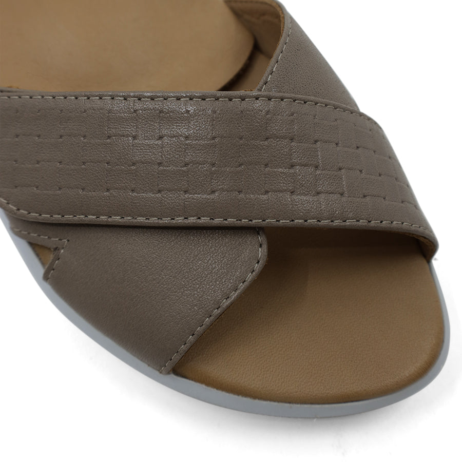 FRONT VIEW OF GREY OPEN TOE SANDAL WITH TWO VELCRO STRAPS AND WHITE SOLE