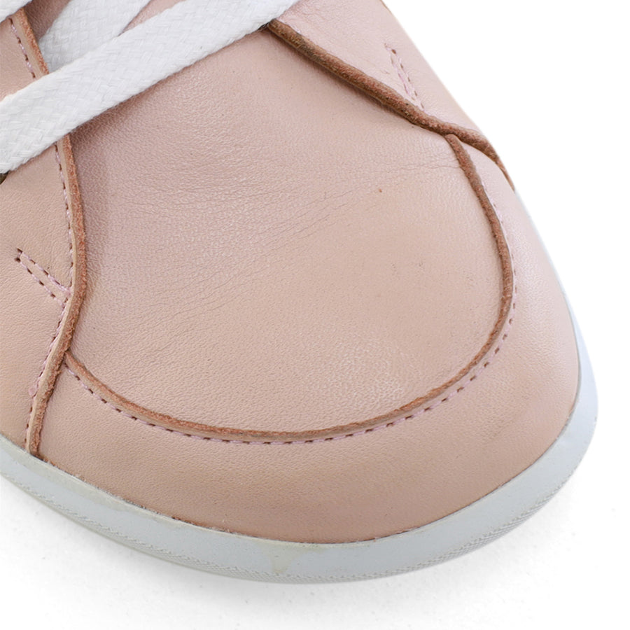 FRONT VIEW OF PINK LACE UP SNEAKER WITH SIDE ZIP AND CUT OUT DETAILING 