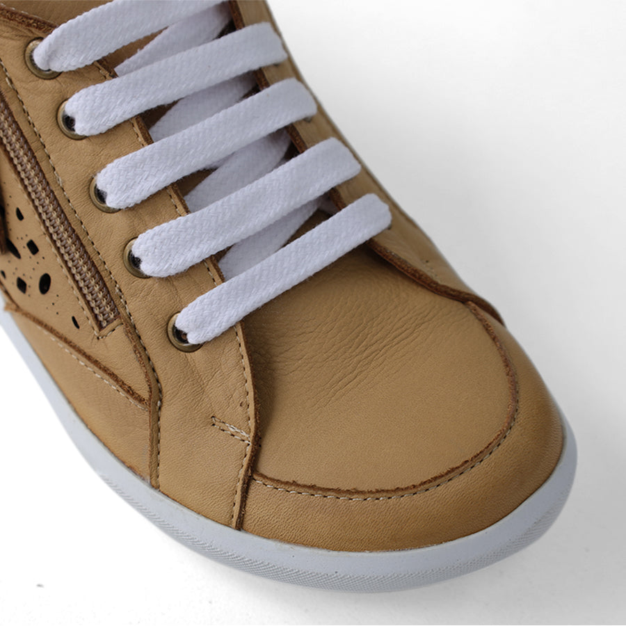 FRONT VIEW OF TAN LACE UP SNEAKER WITH SIDE ZIP AND CUT OUT DETAILING