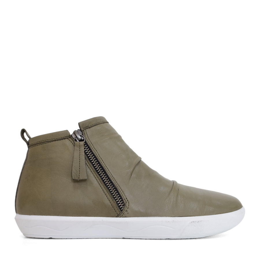 SIDE VIEW OF BLACK ANKLE BOOT WITH SIDE ZIP AND WHITE SOLE