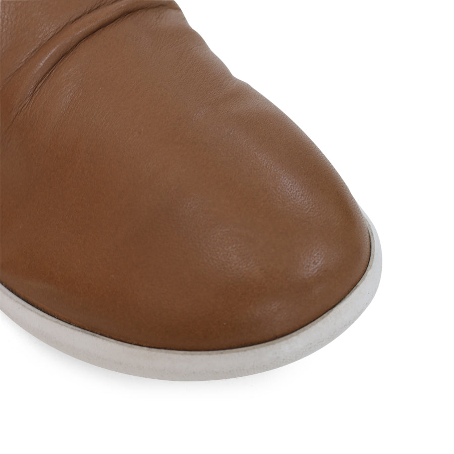 FRONT VIEW OF BROWN ANKLE BOOT WITH SIDE ZIP AND WHITE SOLE