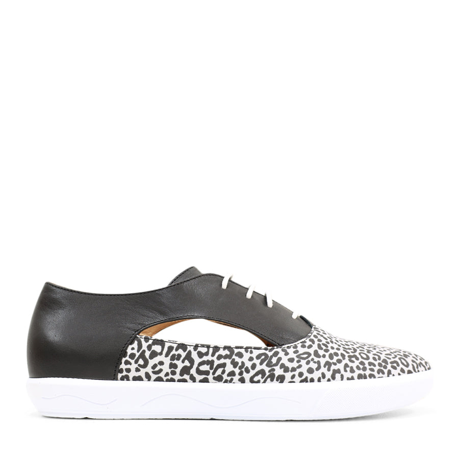SIDE VIEW OF BLACK CASUAL LACE UP SHOE WITH LEOPARD PRINT FRONT AND SIDE CUT OUTS