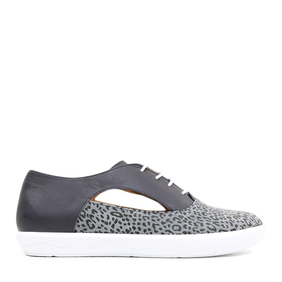 SIDE VIEW OF BLUE CASUAL LACE UP SHOE WITH LEOPARD PRINT FRONT AND SIDE CUT OUTS