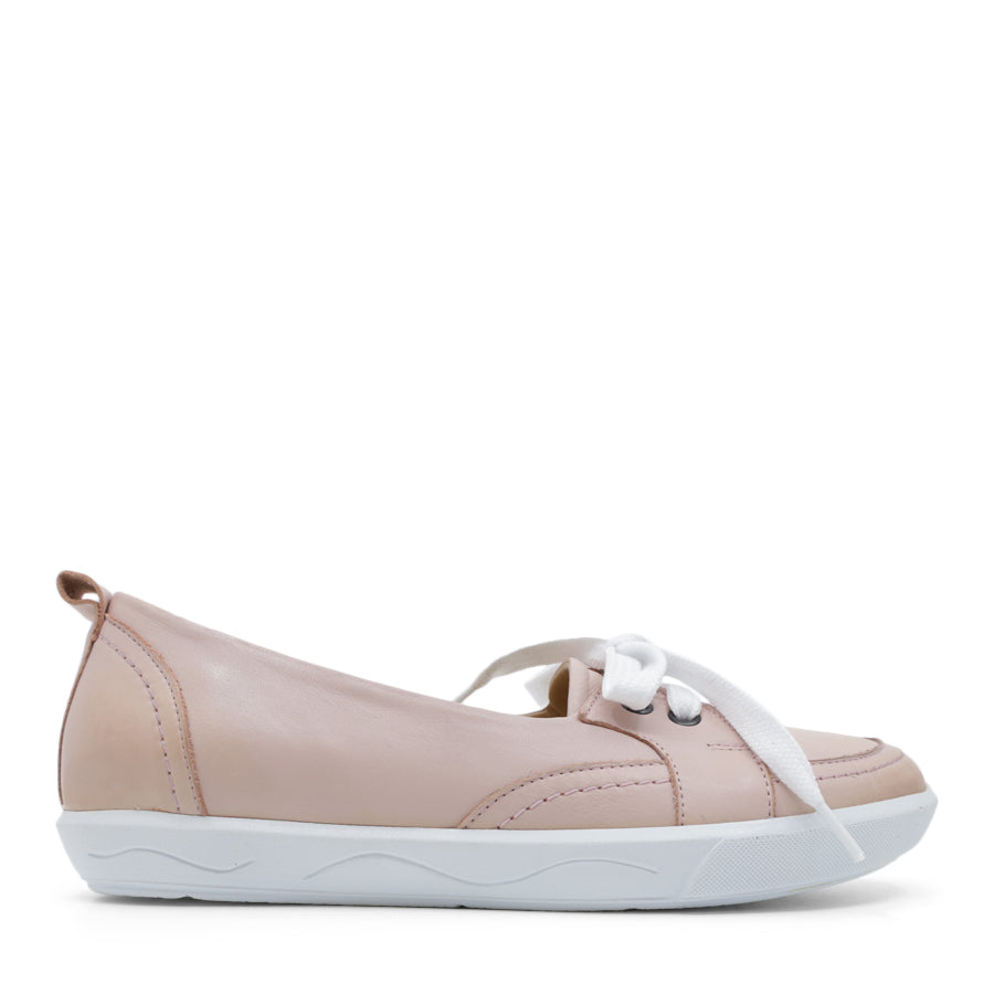 SIDE VIEW OF PINK CASUAL SHOE WITH LACES AT THE FRONT AND WHITE SOLE 
