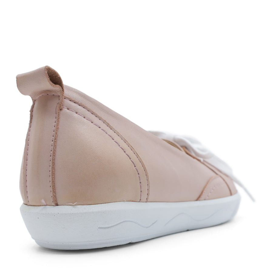 BACK VIEW OF PINK CASUAL SHOE WITH LACES AT THE FRONT AND WHITE SOLE 