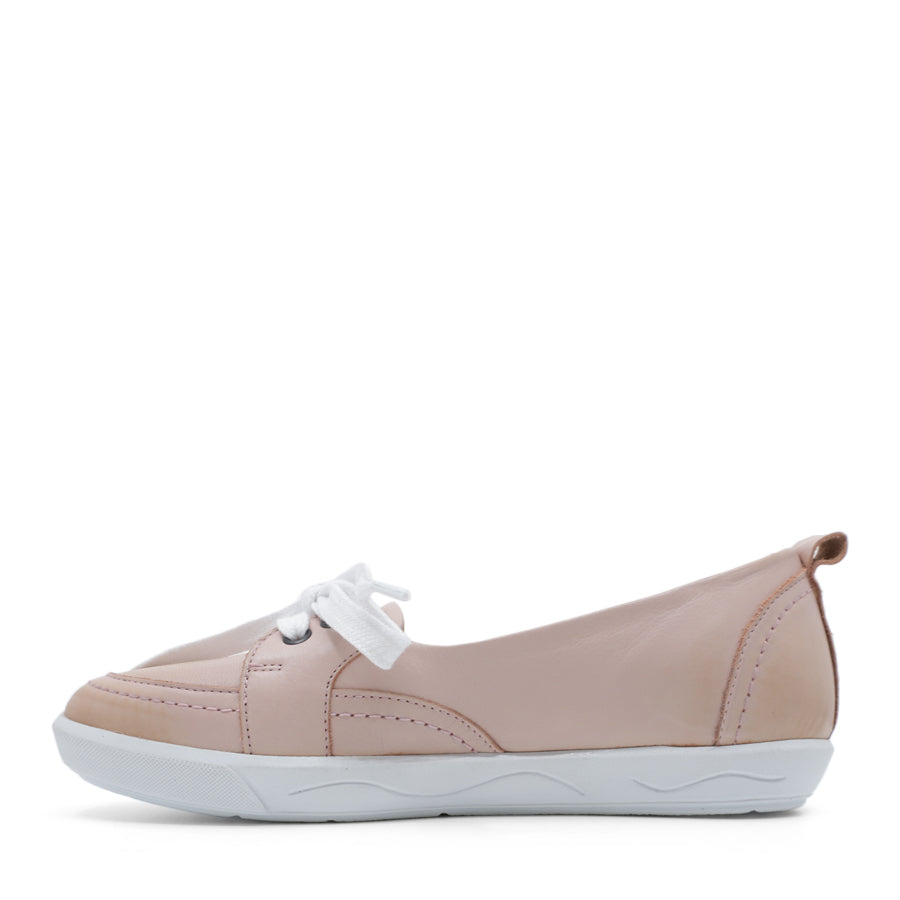 SIDE VIEW OF PINK CASUAL SHOE WITH LACES AT THE FRONT AND WHITE SOLE 