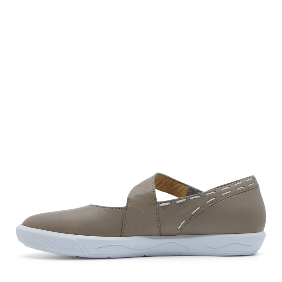 SIDE VIEW OF GREY CASUAL SHOE WITH STRAP, WHITE STITCH DETAIL AND WHITE SOLE 