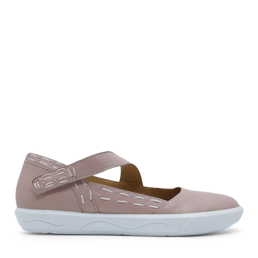 SIDE VIEW OF PINK CASUAL SHOE WITH STRAP, WHITE STITCH DETAIL AND WHITE SOLE 