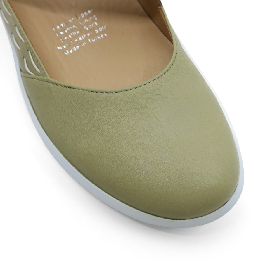 FRONT VIEW OF GREEN CASUAL SHOE WITH STRAP, WHITE STITCH DETAIL AND WHITE SOLE