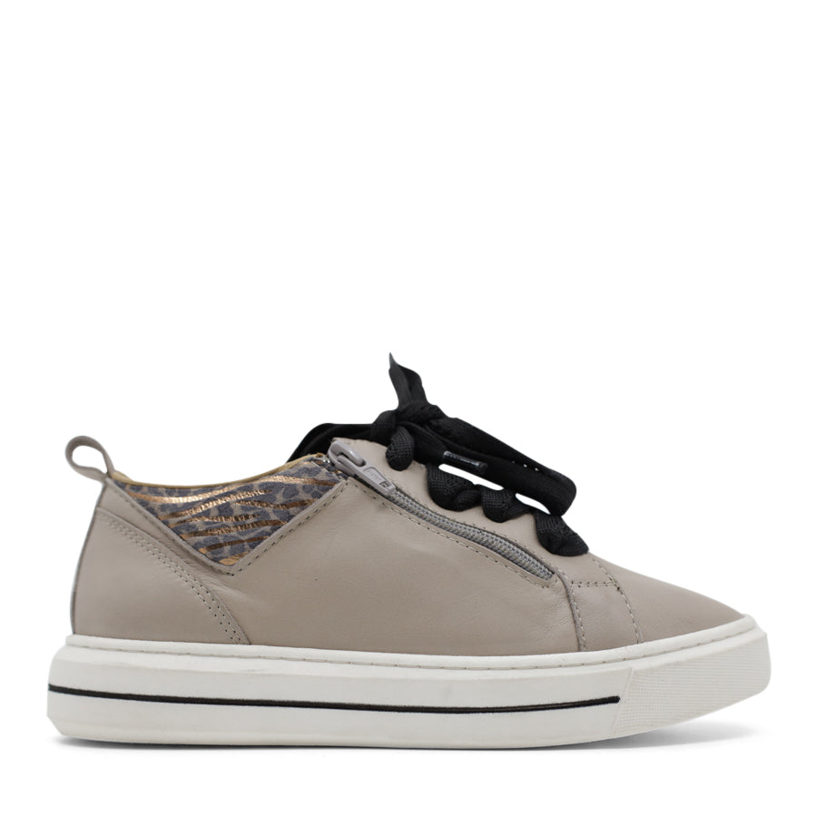 SIDE VIEW OF WHITE CASUAL LACE UP SHOE WITH SMALL LEOPARD AND GOLD DETAIL ON THE SIDES 