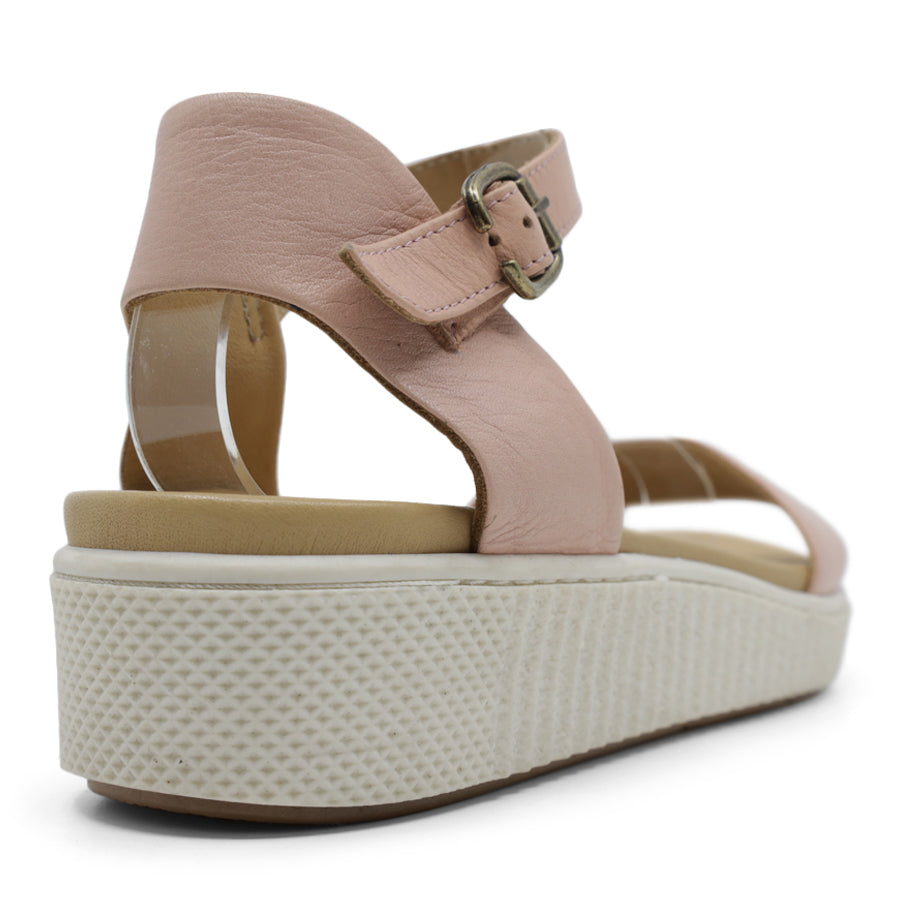 BACK VIEW OF PINK SANDAL WITH BUCKLE AND WHITE SOLE
