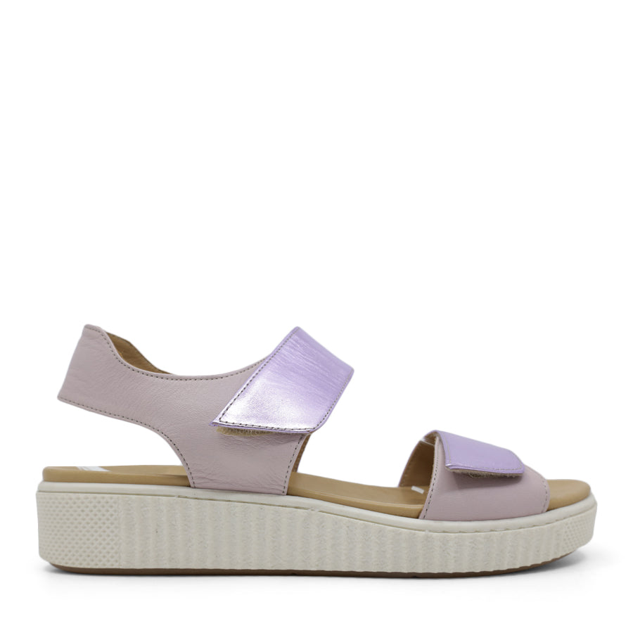 SIDE VIEW OF METALLIC PINK SANDAL WITH TWO VELCRO STRAPS AND WHITE SOLE 