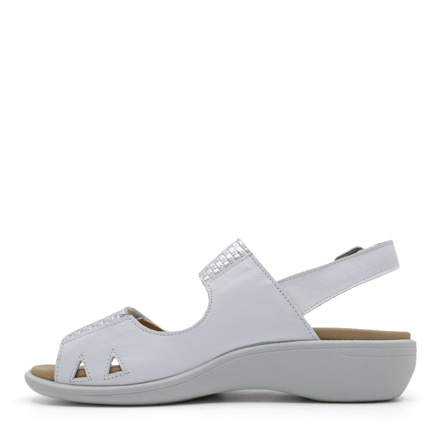  SIDE VIEW OF WHITE Y BACK SANDAL WITH BUCKLE AND CUT OUT DETAILLING NEAR TOES