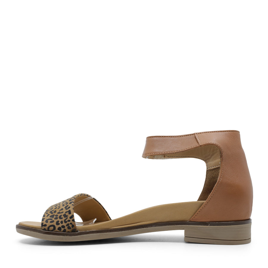 SIDE VIEW OF BEIGE LEATHER SANDAL WITH LEOPARD PRINT DETAIL ON FRONT AND VELCRO STRAP TO SECURE 