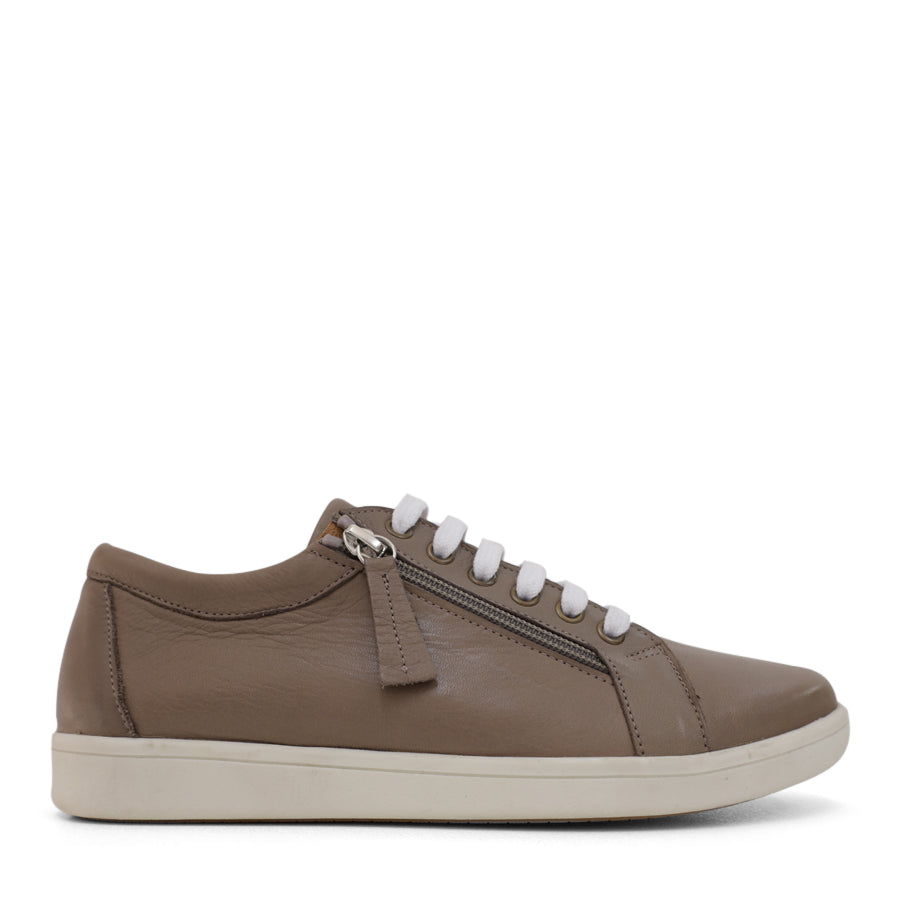 SIDE VIEW OF TAN LACE UP SNEAKER WITH SIDE ZIP AND WHITE SOLE 