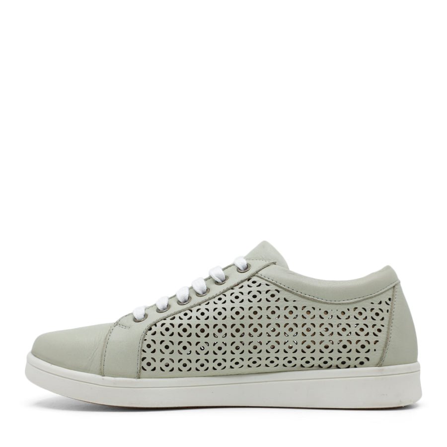 SIDE VIEW OF GREEN LACE UP SNEAKER WITH SIDE ZIP AND WHITE SOLE. PERFORATED DETAIL ON SIDE PANELS 