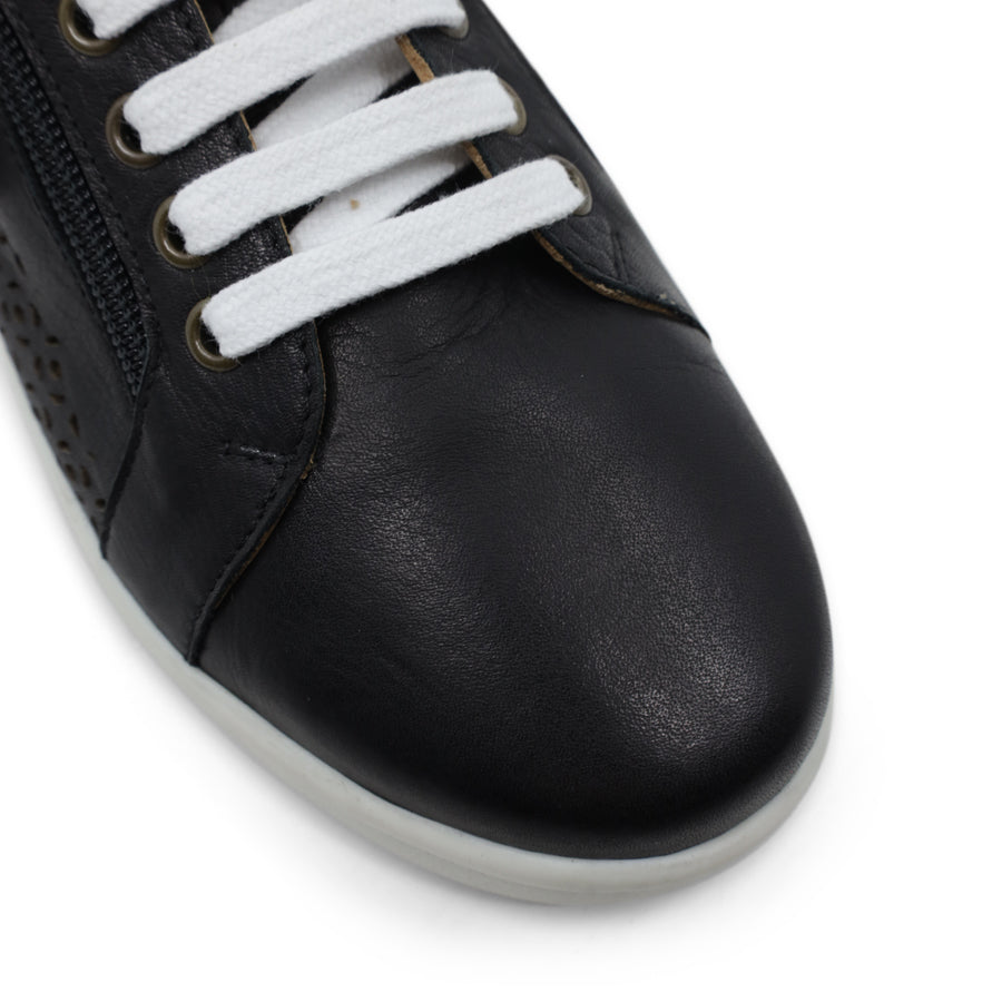 FRONT VIEW OF BLACK LACE UP SNEAKER WITH SIDE ZIP AND WHITE SOLE. PERFORATED DETAIL ON SIDE PANELS