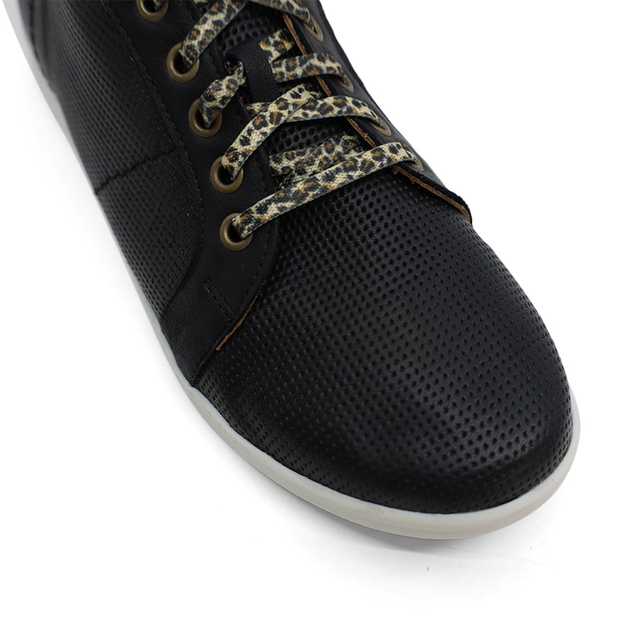 FRONT VIEW OF BLACK LACE UP SNEAKER WITH WHITE SOLE AND LEOPARD PRINT SHOE LACES 