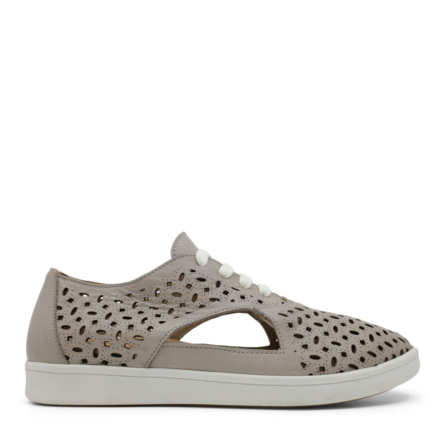 SIDE VIEW OF PINK LACE UP CASUAL SHOE WITH SPECKLE CUT OUT DETAILING 