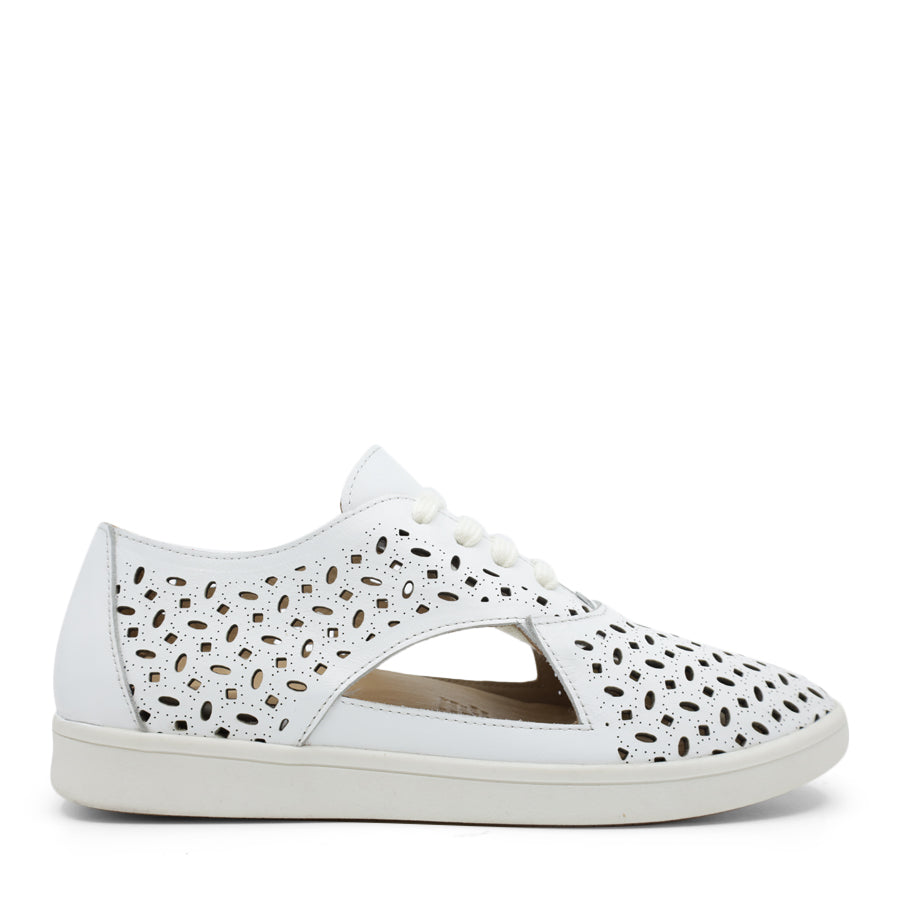SIDE VIEW OF WHITE LACE UP CASUAL SHOE WITH SPECKLE CUT OUT DETAILING 