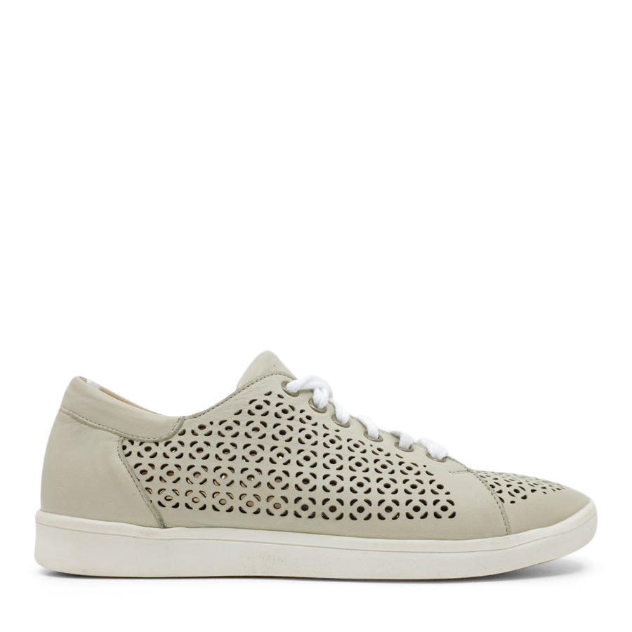 SIDE VIEW OF LIGHT GREEN LACE UP CASUAL SHOE WITH SPECKLE CUT OUT DETAILING  
