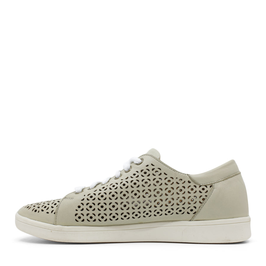 SIDE VIEW OF LIGHT GREEN LACE UP CASUAL SHOE WITH SPECKLE CUT OUT DETAILING  