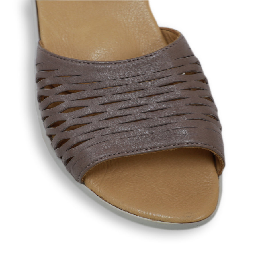 FRONT VIEW OF GREY SANDAL WITH WHITE SOLE AND ADJUSTABLE BUCKLE 