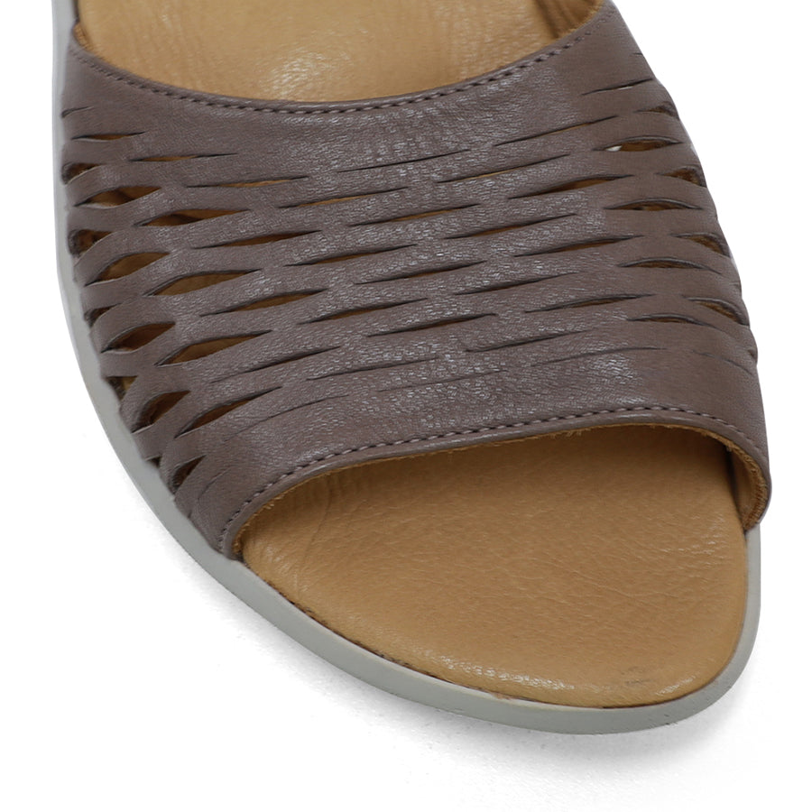 FRONT VIEW OF GREY SANDAL WITH WHITE SOLE AND ADJUSTABLE BUCKLE 