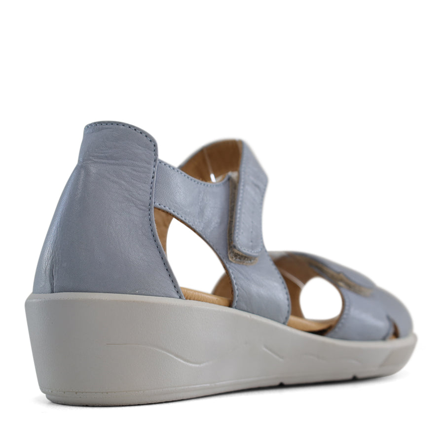 BACK VIEW OF BLUE OPEN TOE SANDAL WITH TWO VELCRO STRAPS AND WHITE SOLE