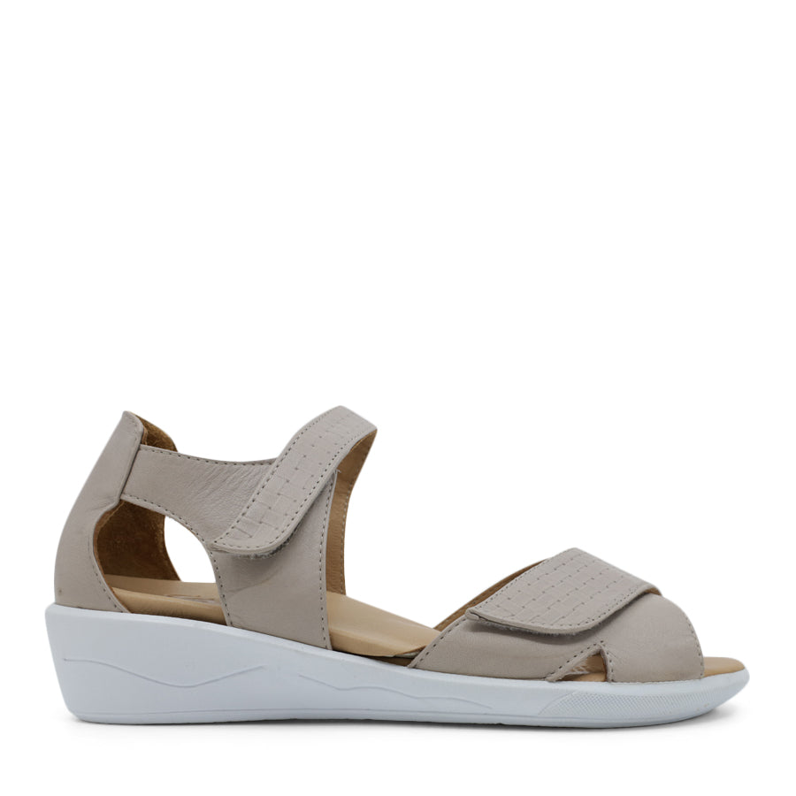SIDE VIEW OF GREY OPEN TOE SANDAL WITH TWO VELCRO STRAPS AND WHITE SOLE