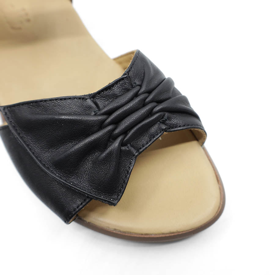 FRONT VIEW OF BLACK DUAL VELCRO CLOSED BACK SANDAL WITH DECORATIVE BUCKLE 