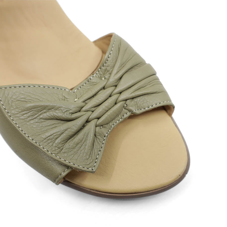 FRONT VIEW OF GREEN DUAL VELCRO CLOSED BACK SANDAL WITH DECORATIVE BUCKLE 