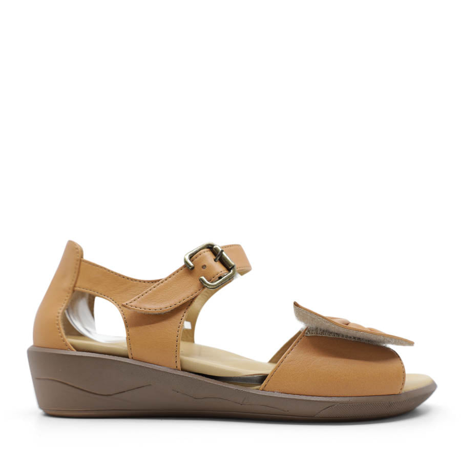 SIDE VIEW OF TAN DUAL VELCRO CLOSED BACK SANDAL WITH DECORATIVE BUCKLE 