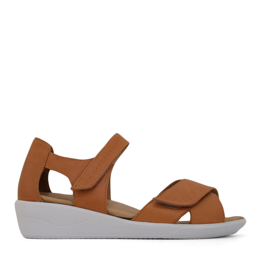  SIDE VIEW OF TAN OPEN TOE SANDAL WITH TWO VELCRO STRAPS AND WHITE SOLE
