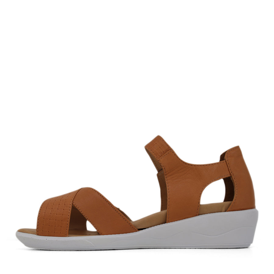 SIDE VIEW OF TAN OPEN TOE SANDAL WITH TWO VELCRO STRAPS AND WHITE SOLE
